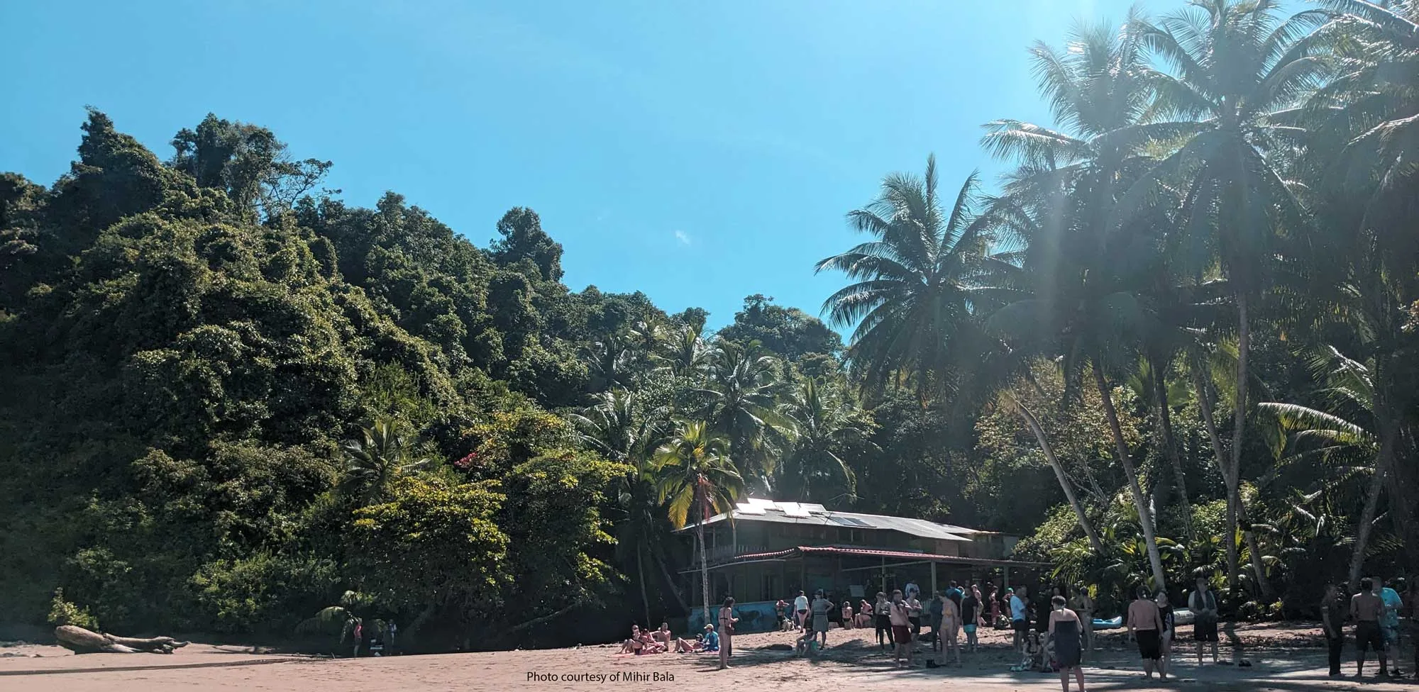 Snorkelers on the beach at Cano Island