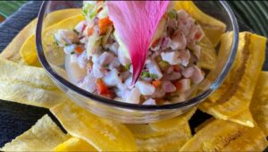 Fresh seafood platter in Bahía Drake, Costa Rica, featuring grilled fish, shrimp, and tropical garnishes