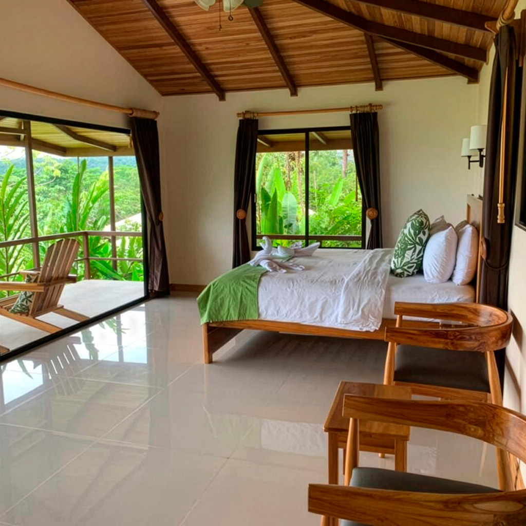 private rainforest bungalow with large windows in Drake Bay